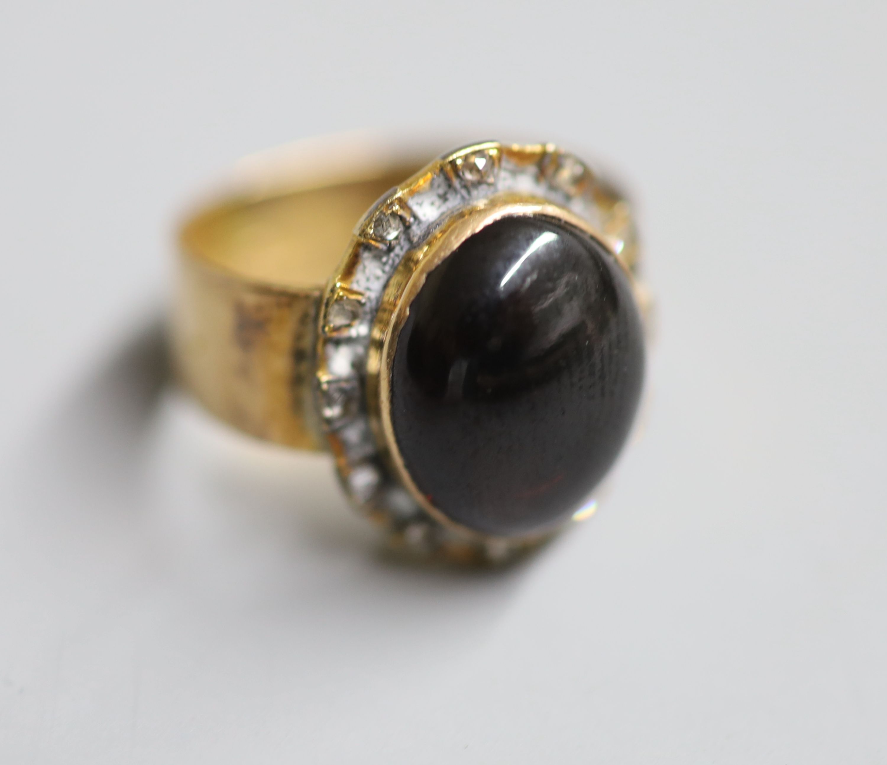 A Victorian 18ct gold, cabochon garnet and rose cut diamond set dress ring, size L, gross 7.4 grams(adapted?).